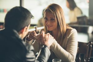 couple holding hands - how to keep a man interested in you